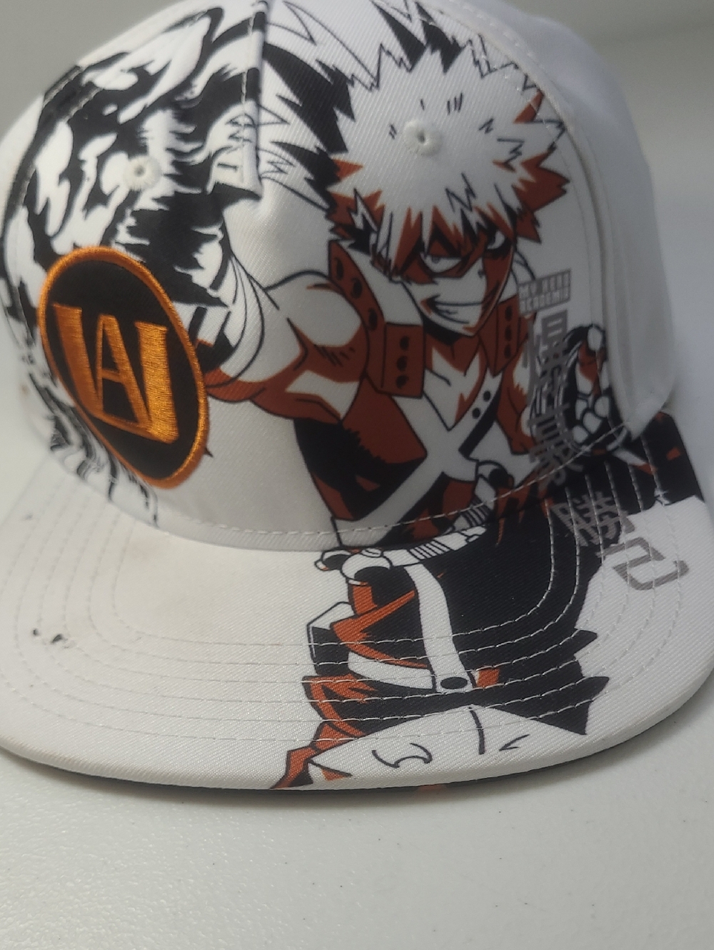 White Anime Graphic Snapback Hat with Orange Accent Katsuki Bakugo